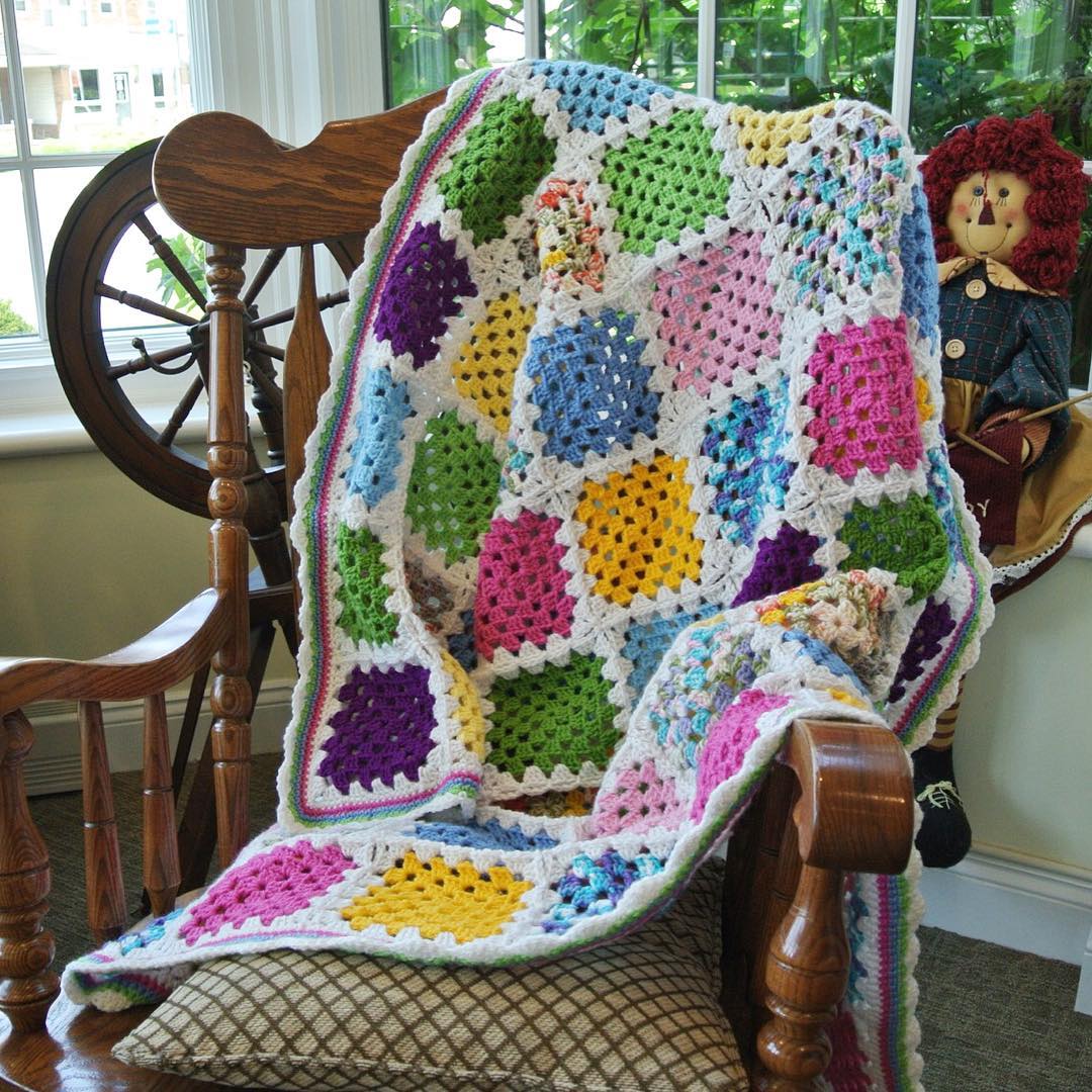 A granny square scrap-ghan assembled using the join-as-you-go slip stitch method