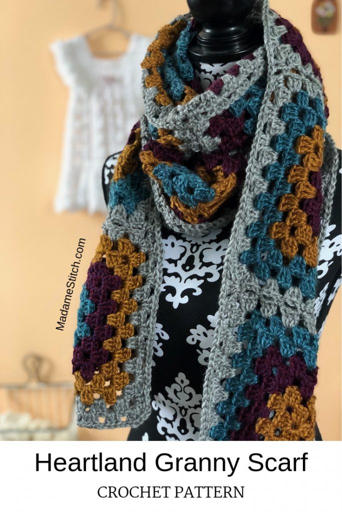 Heartland Granny Scarf | Crochet Pattern by MadameStitch  This scarf is the perfect fall accessory. Made with Lion Brand's Heartland worsted weight yarn, the 10 granny squares work up quickly. Skill level: Beginner #crochetscarf #scarfpattern #crochetpattern