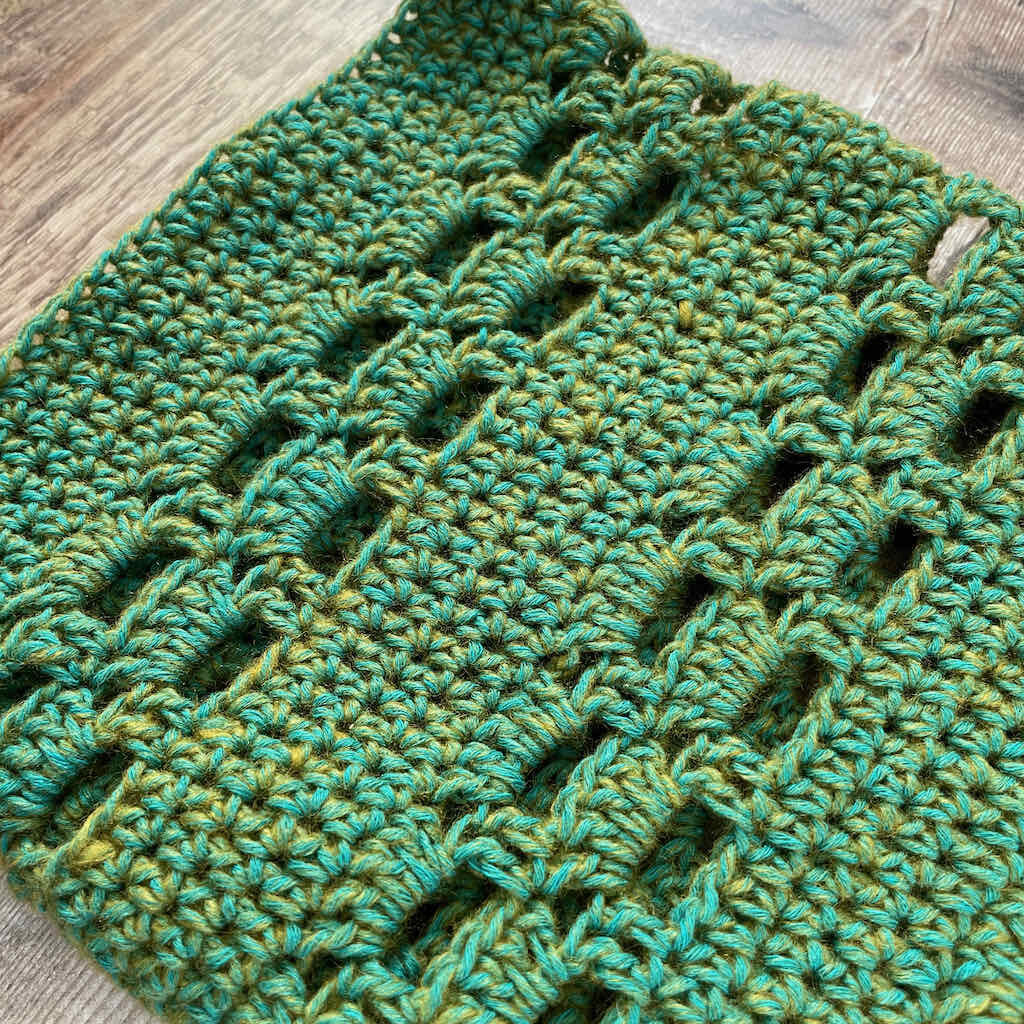 Closeup of the Window on the World cowl, boxed block stitch