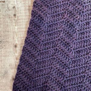 Closeup of simple ripple stitch on board