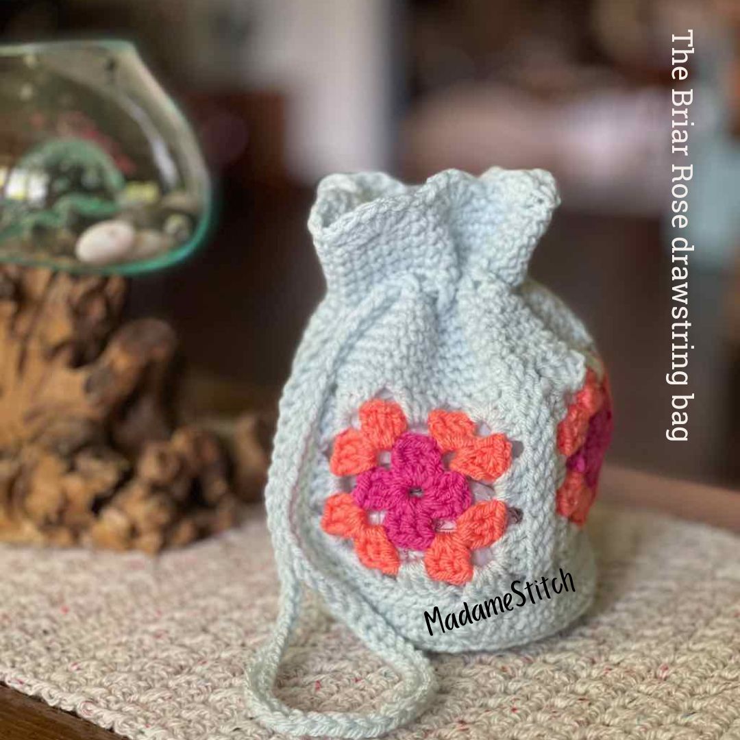 Step out in style with this granny square drawstring bag
