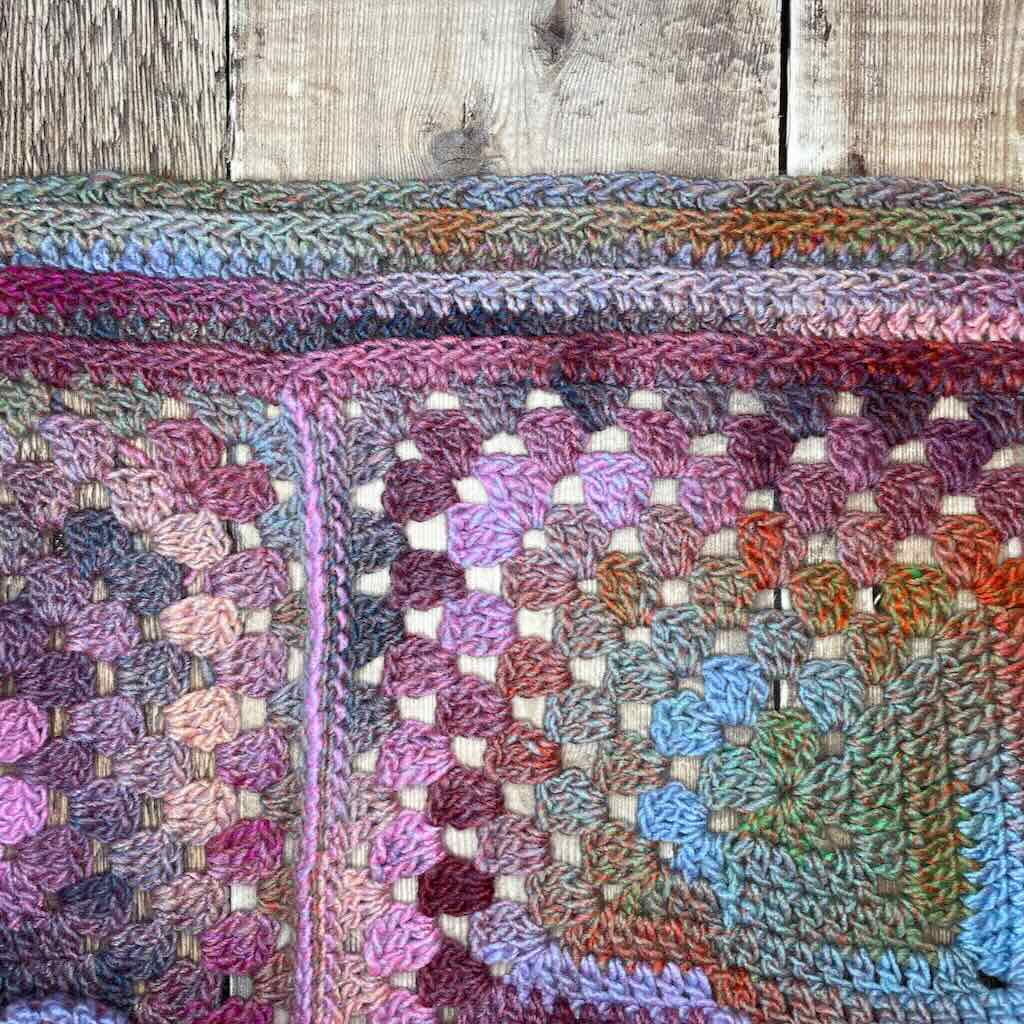 A cozy warm granny square infinity scarf crochet pattern | MadameStitch