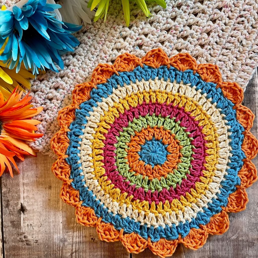 A fun crochet potholder that uses up scrap yarn MadameStitch