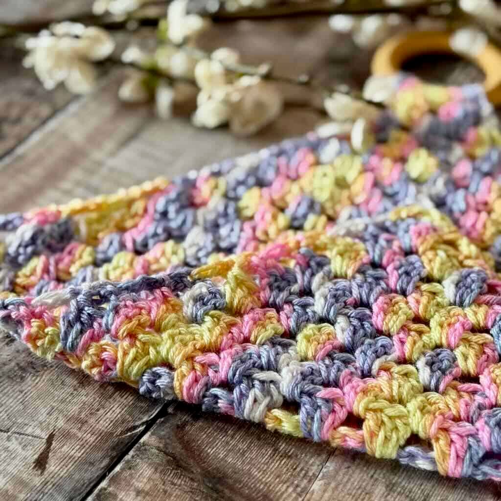 A closeup photo of the Teething Ring Crochet Lovey Blanket