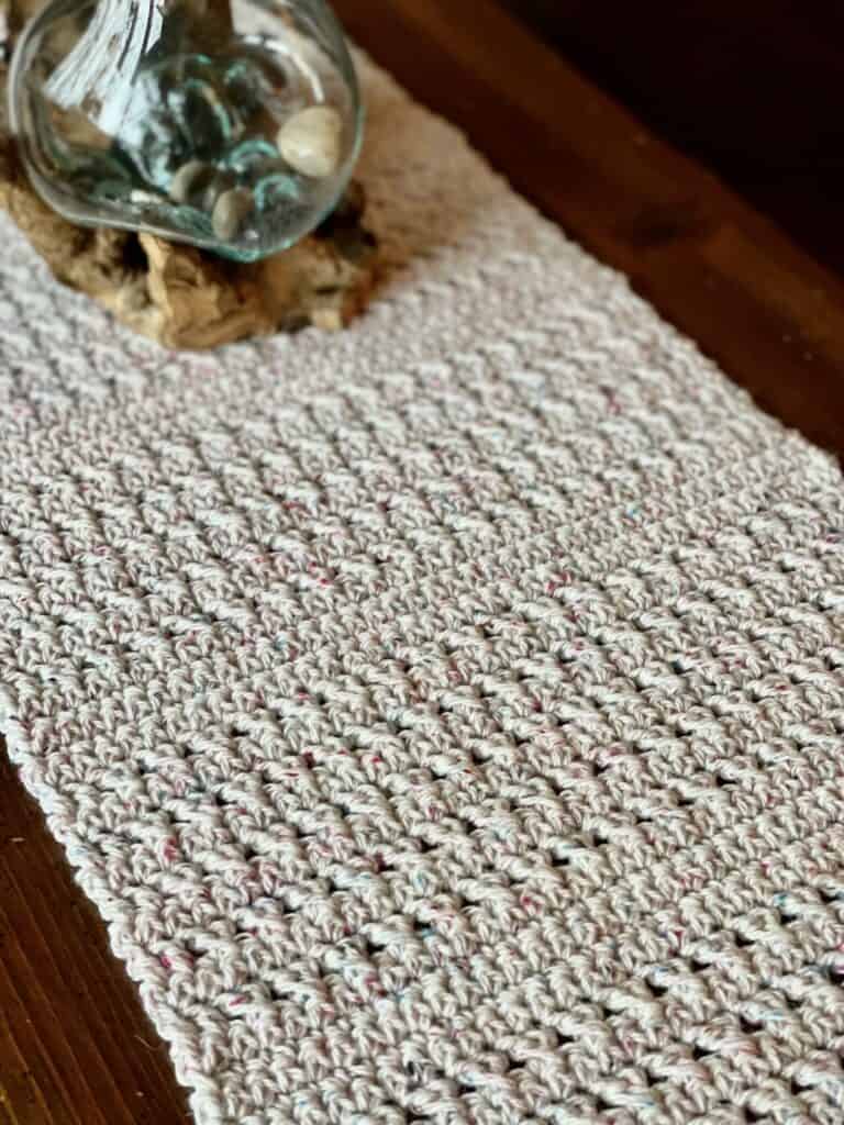 Photo of a crochet table runner | The Pathways Table Runner crochet pattern is free on the blog