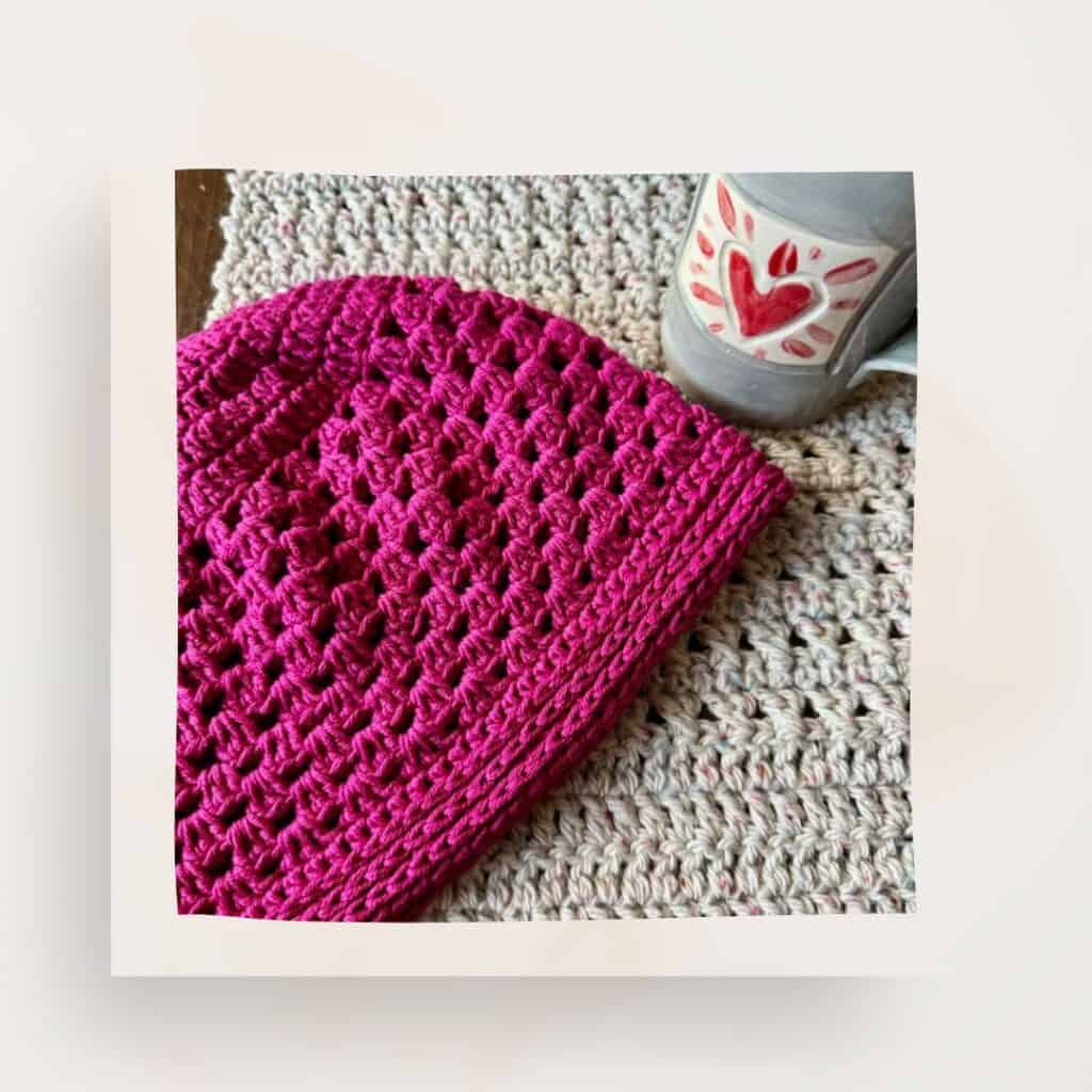 A photo of the Miriam crochet beanie and a cup with a heart on it
