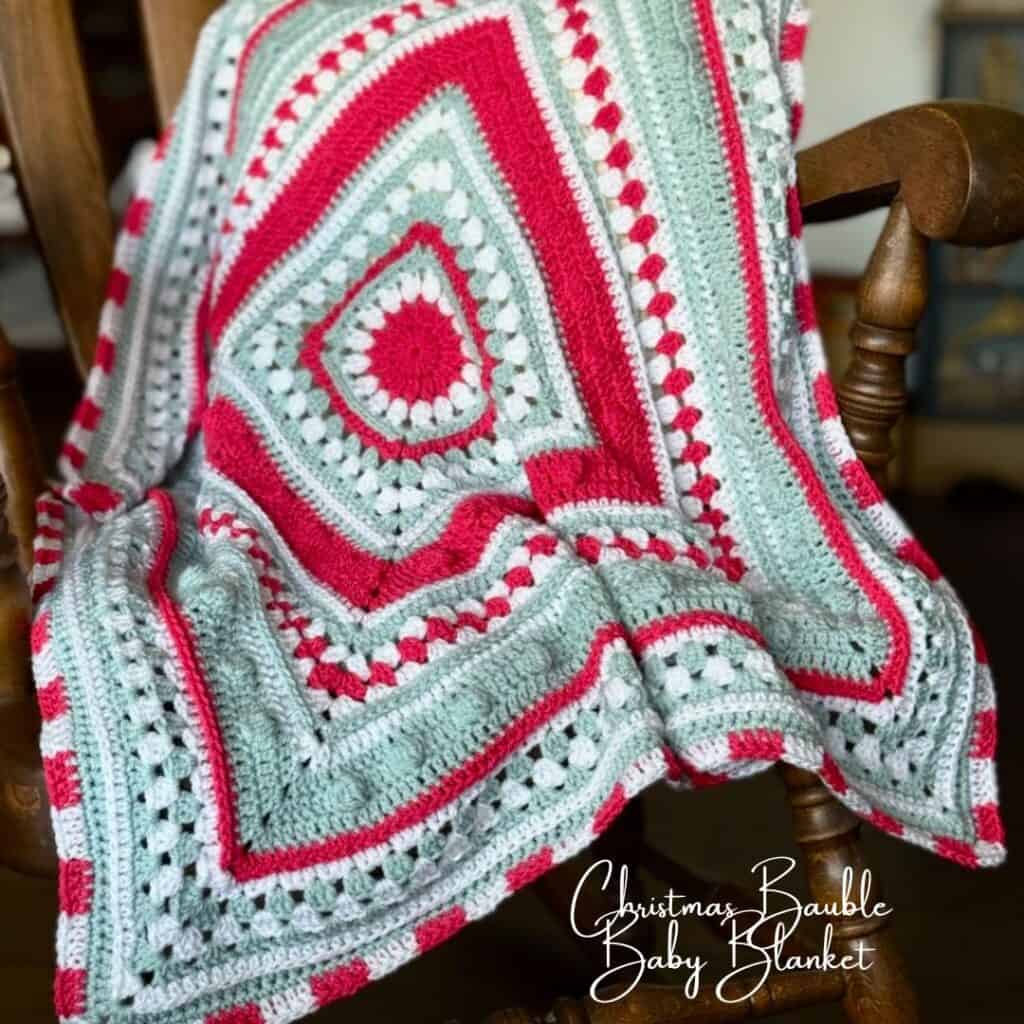 A photo of a Christmas crochet baby blanket | A free pattern by MadameStitch