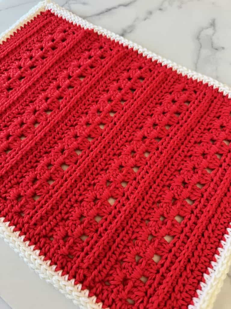 Closeup of a granny stitch placemat in Christmas colors