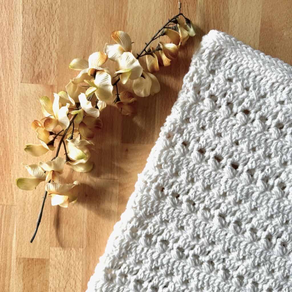 A closeup photo of the Bianca crochet cowl designed by MadameStitch
