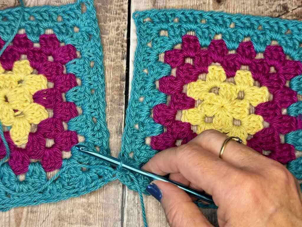 Step 5: Yarn over and pull through all 3 loops on the hook - the 1st slip stitch made.