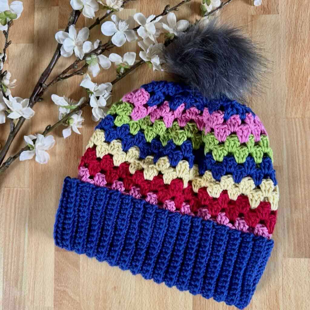 A photo of the granny stripe hat with flowers
