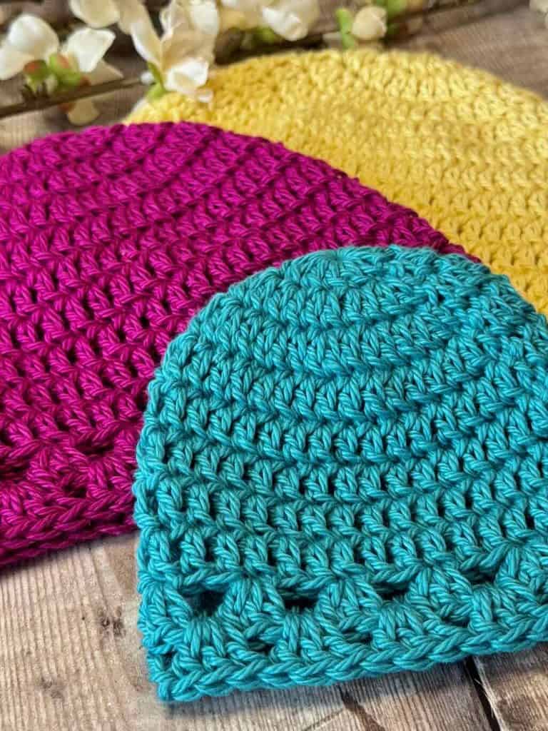 Closeup photo of the 3 sizes of the Logan Crochet Preemie Hat